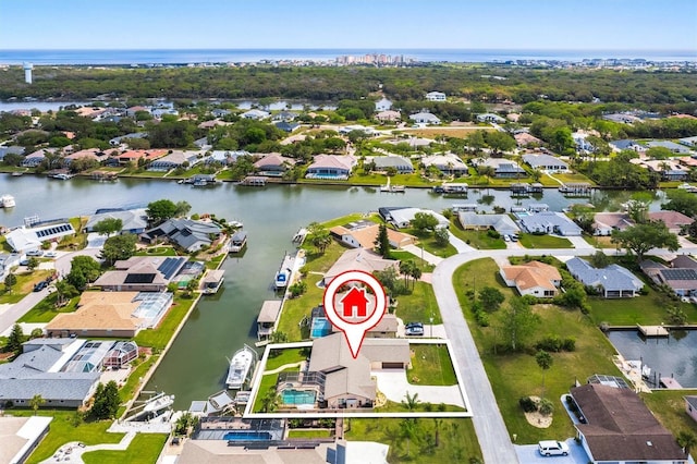 drone / aerial view with a residential view and a water view