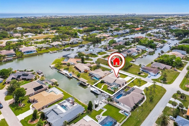 aerial view featuring a residential view and a water view