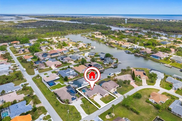 bird's eye view featuring a residential view and a water view
