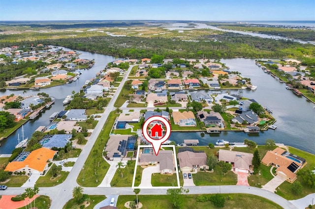 aerial view with a residential view and a water view