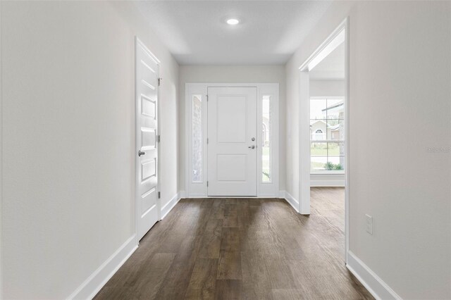 12 Squanto Pl, Palm Coast, FL 32164 - foyer with baseboards and dark wood finished floors