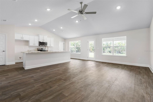 12 Squanto Pl, Palm Coast, FL 32164 - unfurnished living room featuring vaulted ceiling, a ceiling fan, baseboards, dark wood-style floors, and recessed lighting