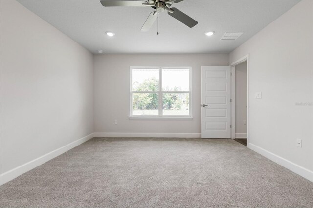 12 Squanto Pl, Palm Coast, FL 32164 - spare room with carpet, a ceiling fan, baseboards, and recessed lighting