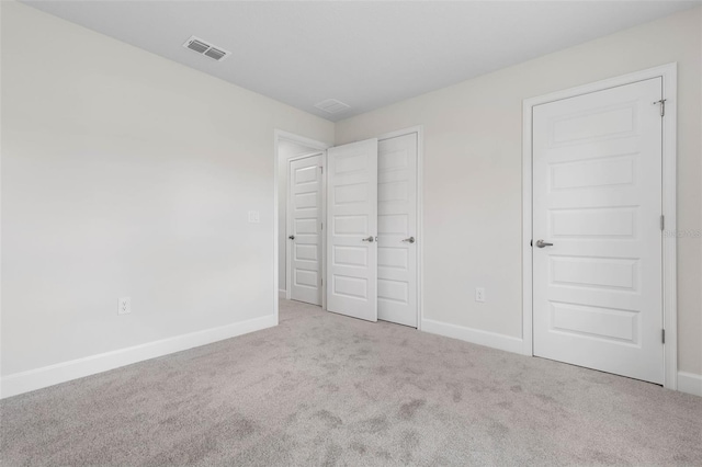 12 Squanto Pl, Palm Coast, FL 32164 - unfurnished bedroom with baseboards and carpet