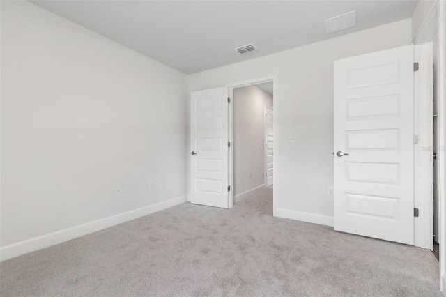12 Squanto Pl, Palm Coast, FL 32164 - unfurnished bedroom featuring carpet flooring and baseboards