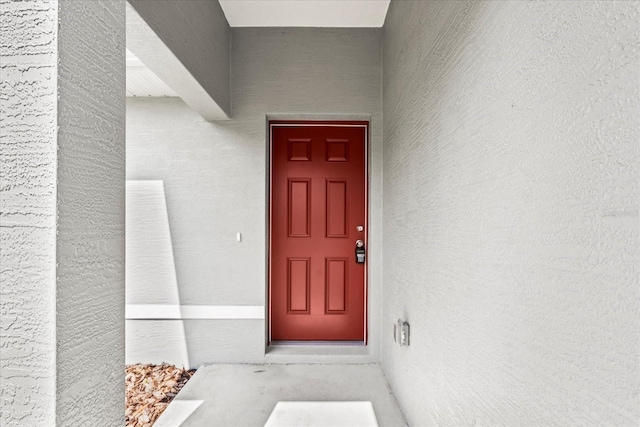 31 Secretary Trl, Palm Coast, FL 32164 - doorway to property with stucco siding