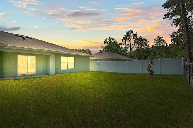 31 Secretary Trl, Palm Coast, FL 32164 - yard at dusk with a fenced backyard