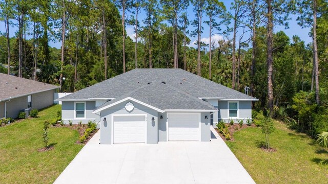 31 Secretary Trl, Palm Coast, FL 32164 - single story home featuring an attached garage, concrete driveway, a front lawn, stucco siding, and a shingled roof