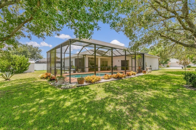 42 Buffalo Bill Dr, Palm Coast, FL 32137 - rear view of property featuring a lanai, an outdoor pool, and a lawn