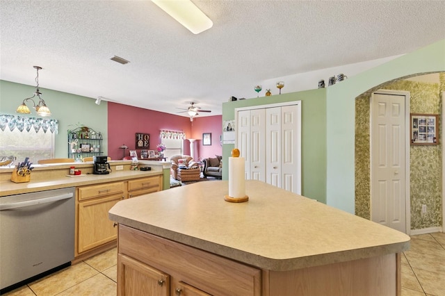 42 Buffalo Bill Dr, Palm Coast, FL 32137 - kitchen with light brown cabinets, a textured ceiling, visible vents, ceiling fan, and stainless steel dishwasher