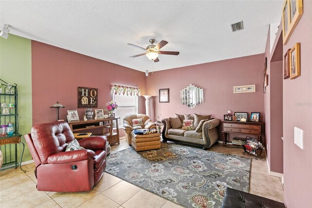 42 Buffalo Bill Dr, Palm Coast, FL 32137 - living room featuring visible vents, a ceiling fan, tile patterned flooring, and a textured ceiling