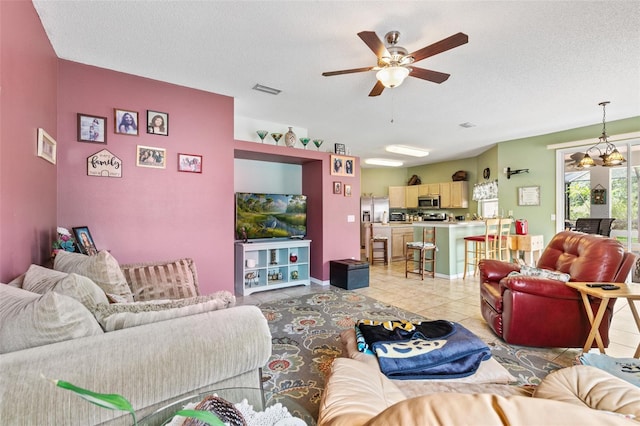 42 Buffalo Bill Dr, Palm Coast, FL 32137 - living room with light tile patterned floors, visible vents, ceiling fan with notable chandelier, and a textured ceiling