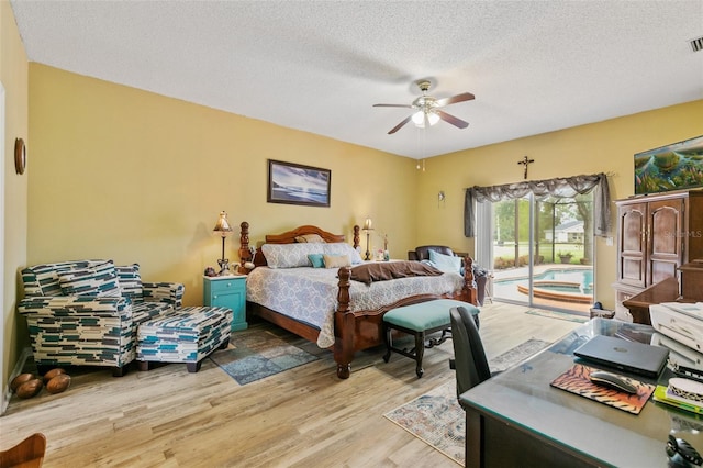 42 Buffalo Bill Dr, Palm Coast, FL 32137 - bedroom with access to outside, light wood-style floors, a textured ceiling, a ceiling fan, and visible vents