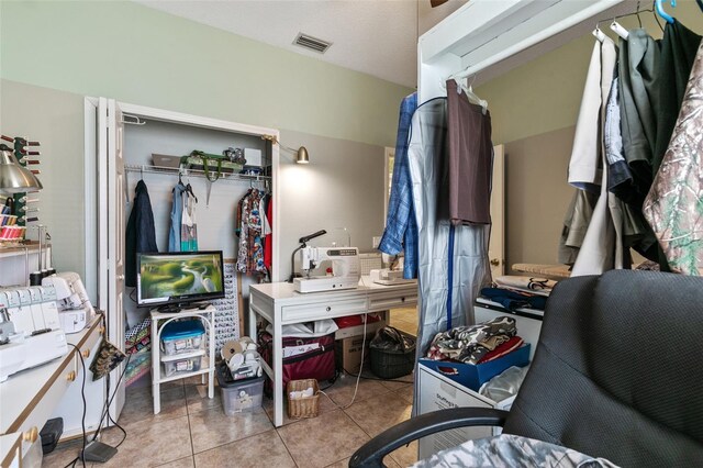 42 Buffalo Bill Dr, Palm Coast, FL 32137 - bedroom with visible vents, a closet, and tile patterned flooring