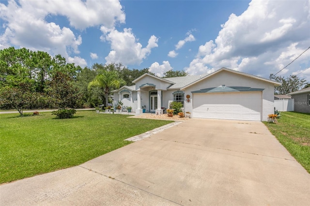 42 Buffalo Bill Dr, Palm Coast, FL 32137 - ranch-style house featuring stucco siding, driveway, a garage, and a front lawn