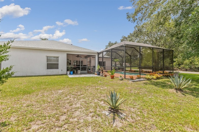 42 Buffalo Bill Dr, Palm Coast, FL 32137 - exterior space with ceiling fan, stucco siding, glass enclosure, a lawn, and an outdoor pool