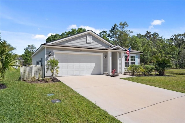 619 Grand Reserve Dr, Bunnell, FL 32110 - single story home featuring a garage, driveway, and a front lawn