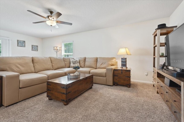 619 Grand Reserve Dr, Bunnell, FL 32110 - living area with a textured ceiling, carpet flooring, baseboards, and a ceiling fan