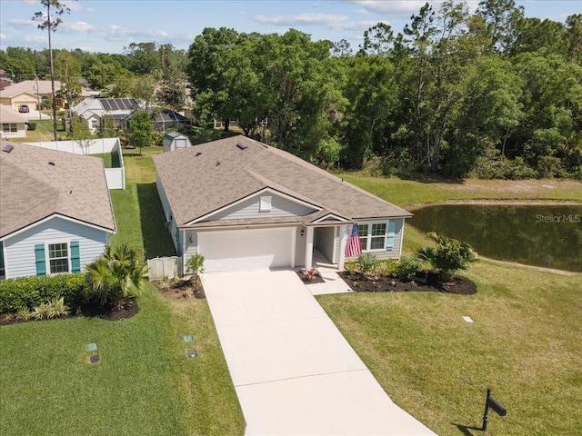 619 Grand Reserve Dr, Bunnell, FL 32110 - ranch-style house with a front yard, driveway, fence, and an attached garage