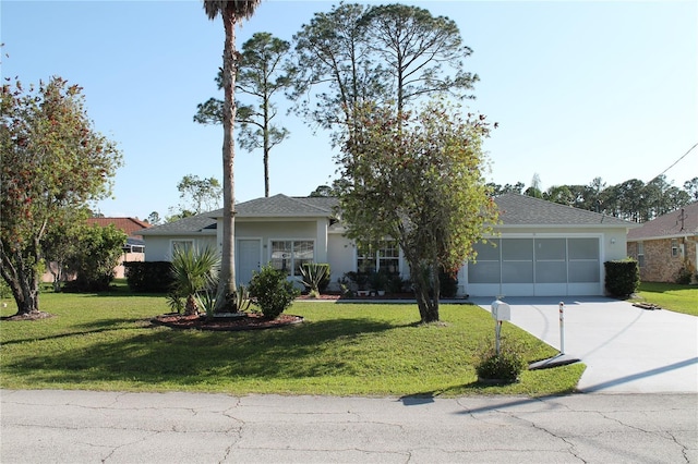 8 Rickenbacker Dr, Palm Coast, FL 32164 - view of front of property featuring a front yard, concrete driveway, a garage, and stucco siding