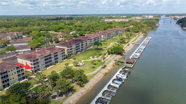 birds eye view of property with a water view