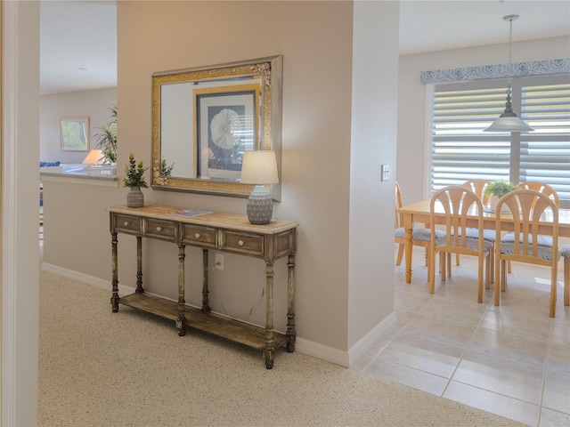 corridor featuring baseboards