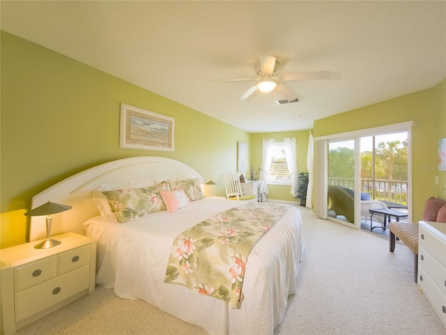 bedroom featuring carpet floors, visible vents, access to outside, and ceiling fan