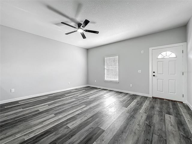10625 Amos Ave, Hastings, FL 32145 - interior space with dark wood-style flooring, ceiling fan, baseboards, and a textured ceiling
