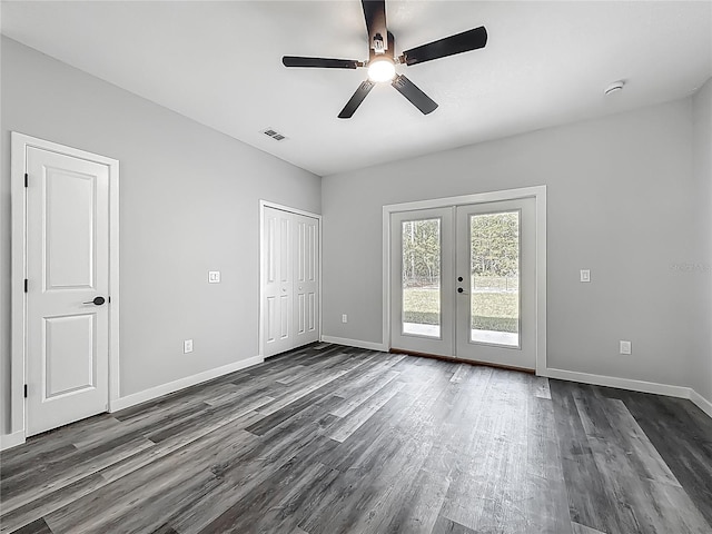 10625 Amos Ave, Hastings, FL 32145 - unfurnished bedroom featuring baseboards, french doors, dark wood-type flooring, visible vents, and access to exterior