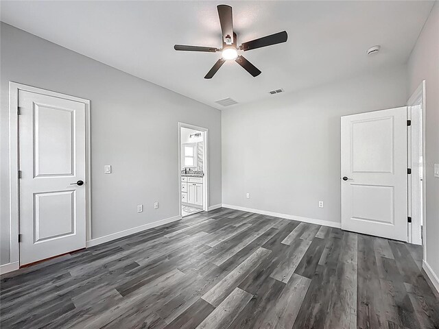 10625 Amos Ave, Hastings, FL 32145 - unfurnished bedroom with visible vents, dark wood-style flooring, baseboards, and a ceiling fan