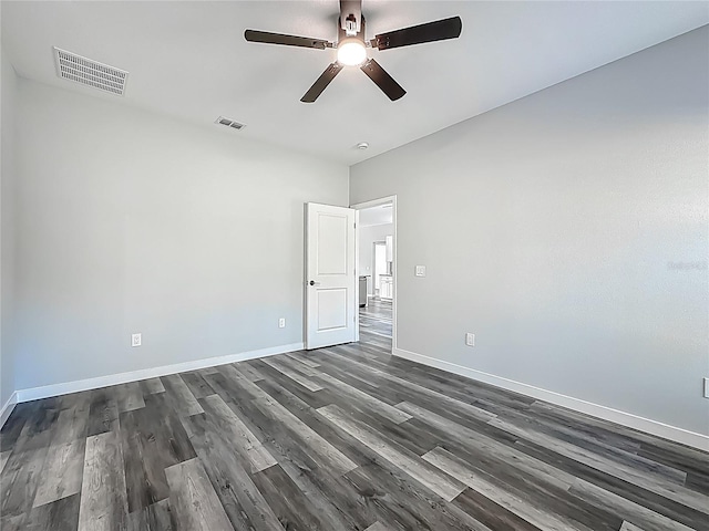 10625 Amos Ave, Hastings, FL 32145 - empty room featuring dark wood-type flooring, visible vents, baseboards, and a ceiling fan