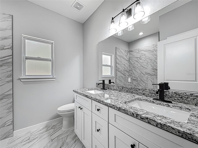 10625 Amos Ave, Hastings, FL 32145 - full bathroom with baseboards, marble finish floor, a sink, and toilet