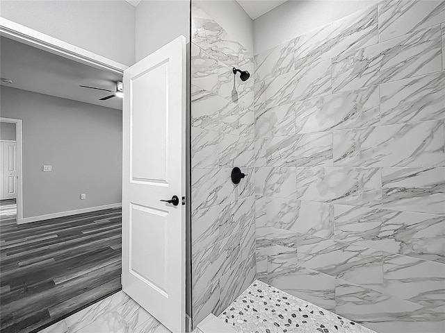 10625 Amos Ave, Hastings, FL 32145 - bathroom with a tile shower, marble finish floor, baseboards, and a ceiling fan