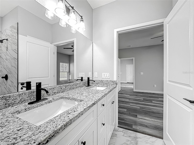 10625 Amos Ave, Hastings, FL 32145 - bathroom featuring double vanity, marble finish floor, a sink, and ceiling fan
