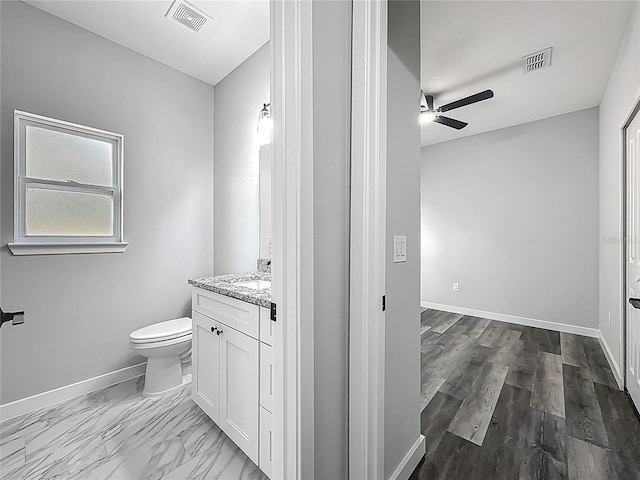10625 Amos Ave, Hastings, FL 32145 - bathroom with visible vents, toilet, a ceiling fan, and vanity