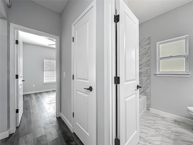 10625 Amos Ave, Hastings, FL 32145 - hallway with marble finish floor and baseboards