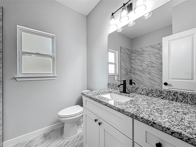 10625 Amos Ave, Hastings, FL 32145 - bathroom with toilet, baseboards, marble finish floor, and vanity