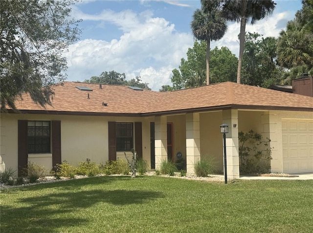 ranch-style house featuring a shingled roof, a garage, stucco siding, and a front lawn
