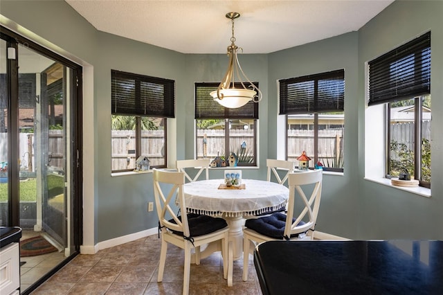tiled dining area with baseboards