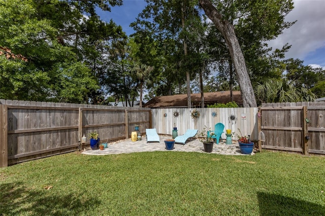 view of yard with a fenced backyard