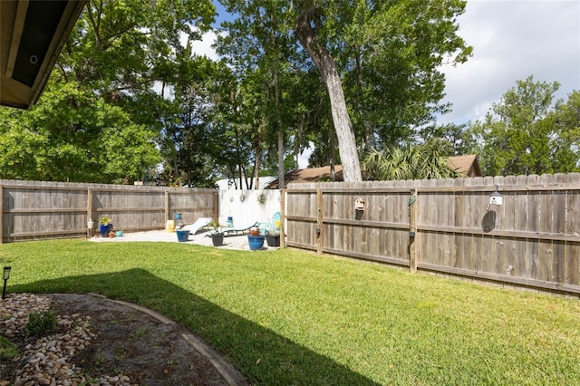 view of yard with a fenced backyard