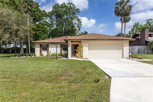 single story home featuring stucco siding, a front yard, fence, an attached garage, and driveway