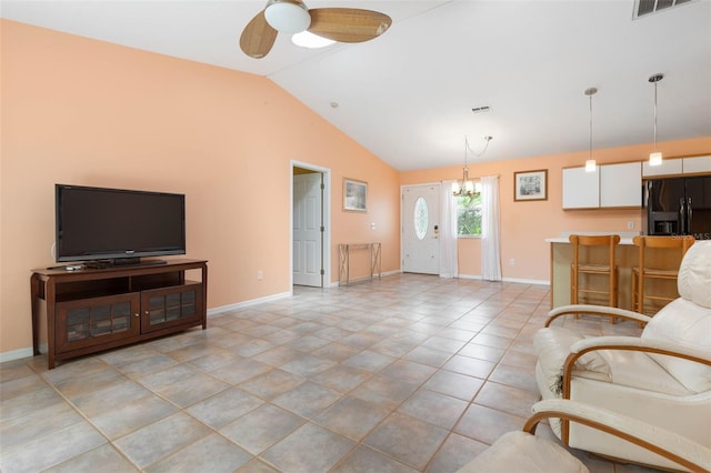 living room featuring visible vents, baseboards, lofted ceiling, and ceiling fan with notable chandelier