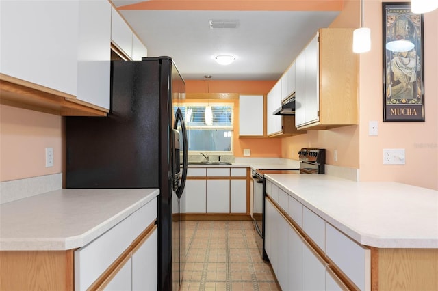 kitchen featuring black appliances, under cabinet range hood, visible vents, light floors, and a sink