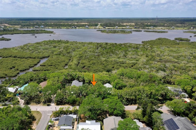 aerial view with a water view and a forest view