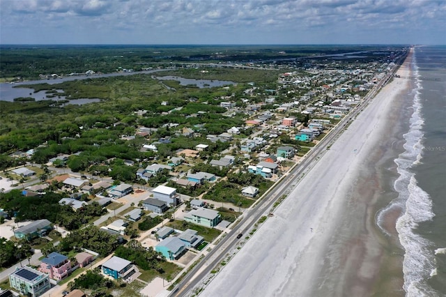aerial view featuring a water view and a view of the beach