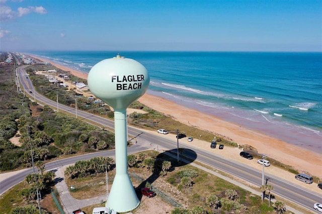 aerial view with a water view and a view of the beach