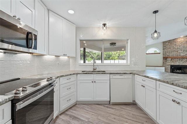 75 Fortune Ln, Palm Coast, FL 32137 - kitchen with appliances with stainless steel finishes, plenty of natural light, decorative backsplash, and recessed lighting