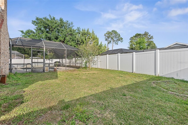 75 Fortune Ln, Palm Coast, FL 32137 - fenced backyard with a lanai, a patio, and a pool