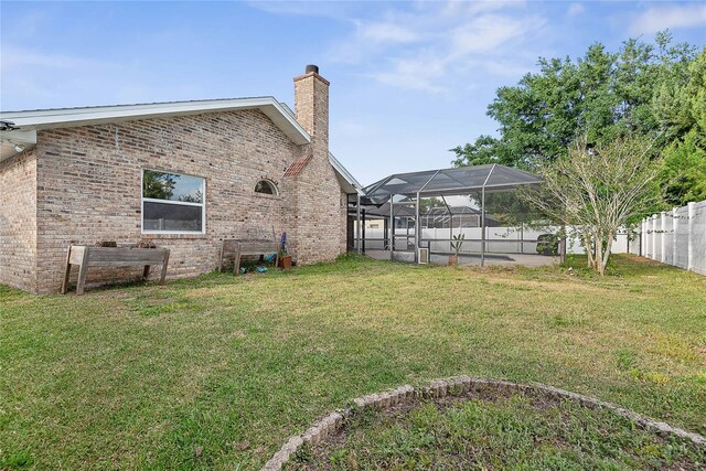 75 Fortune Ln, Palm Coast, FL 32137 - fenced backyard with glass enclosure